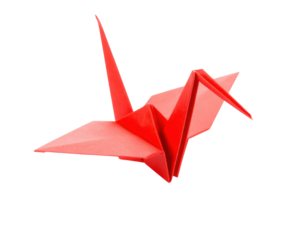 A vibrant red origami crane showcasing intricate folds and a sleek design, representing artistry and tradition.