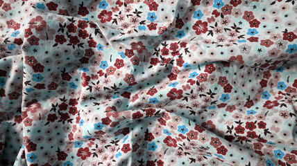 Photo background made of printed fabric. Many chaotic folds. Ornament of different flowers and...