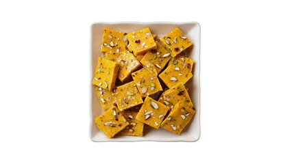 Delicious Golden Indian Sweets in White Dish