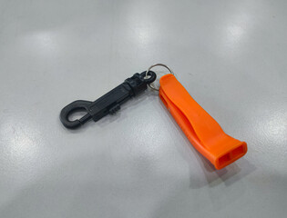 Emergency Survival Death Whistle Double Opening Design on a table