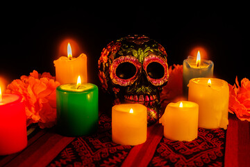 Mexican skull art in black with flower crown and candles for Day of the Dead festivities