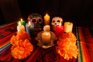 Honoring the dead with skulls, magnolias, and candles on a vivid altar during Day of the Dead...