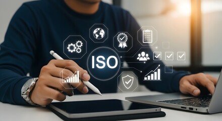 Man Working on Laptop with ISO Certification Graphic Overlay