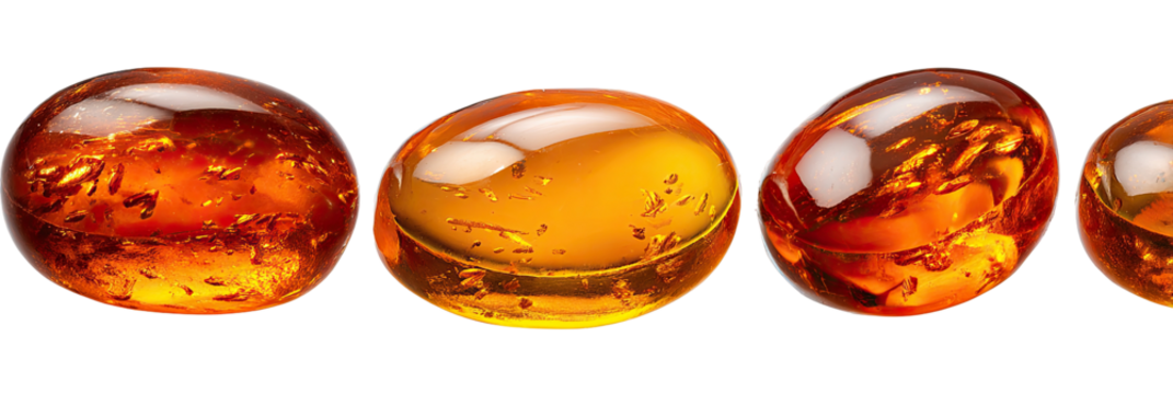 Three oval-shaped, amber-colored gemstones, with intricate internal patterns