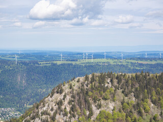 Chasseral, Switzerland - May 26th 2024: Wind engines embedded in the landscape of Mont Crosin