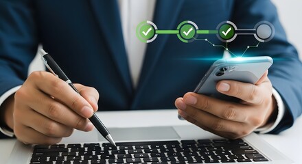 Businessman multitasking with smartphone and laptop technology in modern work setting