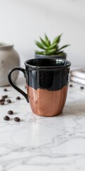 Rustic ceramic coffee cup with copper glaze and handle on marble surface
