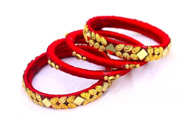 red and gold bracelet isolated on white. red and gold bracelet. background. red background. black and blue bracelet. pink bracelet.