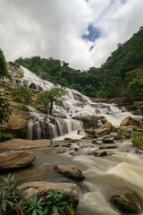 Majestic Waterfall in Chiang Mai Surrounded by Lush Greenery