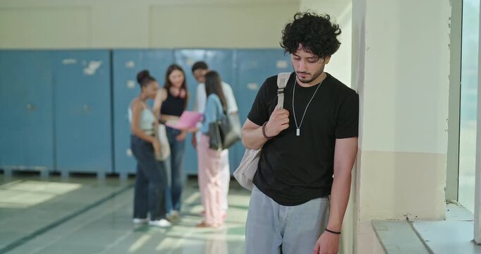 Indian sad young adult gen z man wear bag feel low look upset fail in study exam result indoor campus place alone lost tensed teen male boy suffer mental health social bully issue live bad hostel life