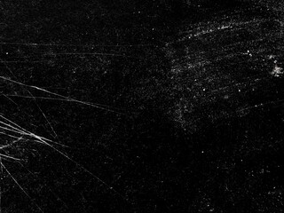 Vintage black grunge texture with white scratches and old film grain effect. White scratches and...