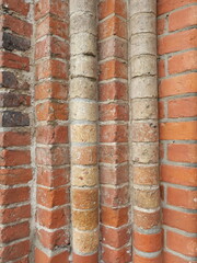 An old wall corner with rounded, molded bricks in the cathedral in Ratzeburg. An expression of...