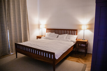 Stylish room interior with big comfortable bed