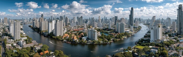 Fototapeta premium The skyline of Bangkok on sunny day, with the Grand Palace, Chao Phraya River prominent, captured from high vantage point. Blue sky with minimal clouds, urban landscape, cityscape photography 