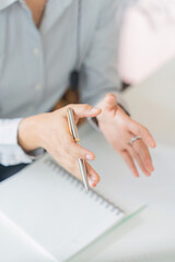 Remote Work. Close-up of woman gesturing during virtual meeting.