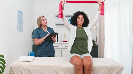 Senior Physiotherapist Guides Young Black Client Through Resistance Band Exercises for Rehabilitation and Recovery at a Professional Small Practice Clinic