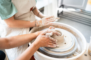 hands of a potter at work