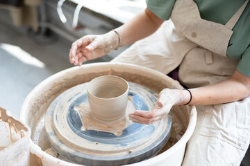 hands of a potter at work