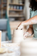 hands of a potter at work