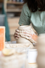 hands of a potter at work