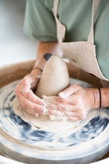 hands of a potter at work