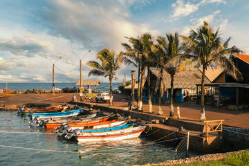 Colorful fishing boats docked at Hanga Roa Otai port in Hanga Roa, Rapa Nui (Easter Island), Chile. This tiny port supports different marine activities, including fishing and diving.