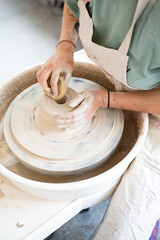 hands of a potter at work