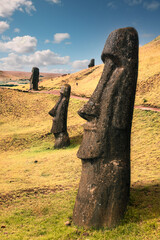 Buried moai statues at Rano Raraku Archaeological Site, Rapa Nui (Easter Island), Chile.  They were covered over time by collapsing mountain ramps and deliberately buried by the Rapa Nui people.