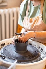hands of a potter at work
