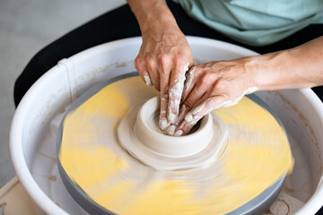 hands of a potter at work