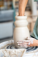 hands of a potter at work