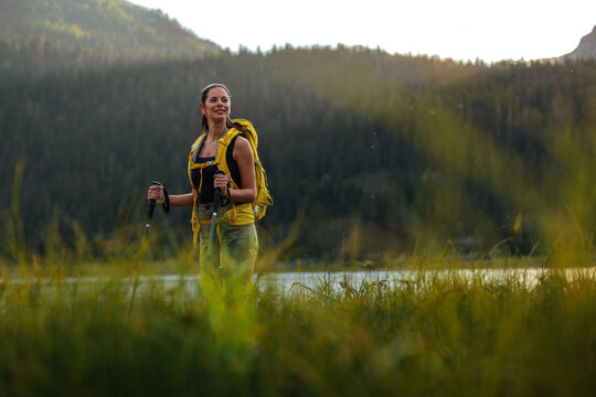 Beautiful young woman on a hiking stroll - Powered by Adobe