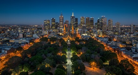 Obraz premium MELBOURNE, AU - Oct 12, 2024: Aerial night view of Melbourne city skyline with illuminated skyscrapers and St Patrick's Cathedral in the foreground. - captured in perfect lighting