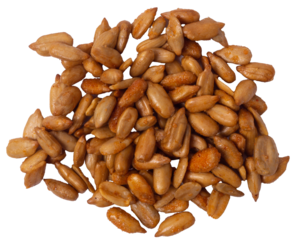 A handful of peeled sunflower seeds in teriyaki sauce on a white background, top view