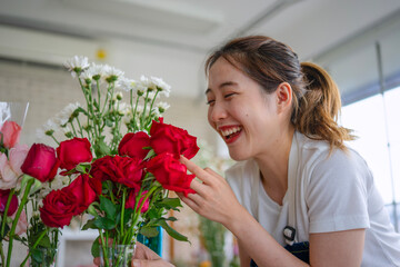 Young entrepreneurs are working at florist shop.