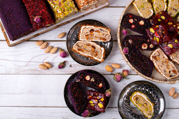 Sliced ​​Turkish delight assortment with cream filling, pistachio, almond, hazelnut, figs and...