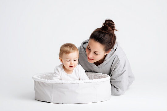Happy mother and daughter spend time together isolated on white background, Portrait of family activity on white background, Definition of love concept with newborn baby and mother.