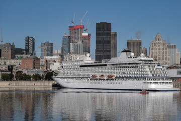 Obraz premium All inclusive luxury yacht cruiseship cruise ship liner Star docked in port St. Lawrence River in Montreal, Quebec Canada during New England Indian Summer cruising