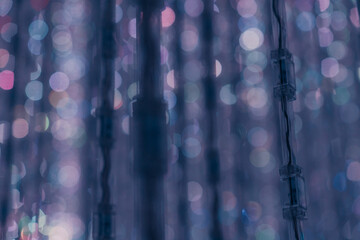 tokyo, japan - Garlands lights white glitter hanging vertical lines rain confetti
