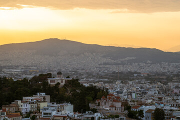 Athens skyline at sunset. The National Observatory of Athens can be seen in the foreground