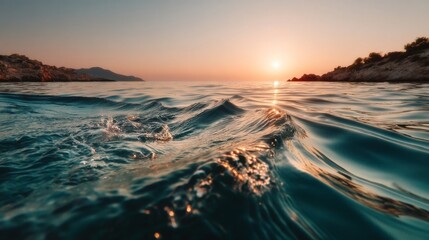 Serene ocean sunset with gentle waves, warm orange hues transitioning to cool blue tones, reflecting sky colors,