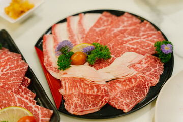 Raw Beef being grilled in Japanese Yakiniku grill