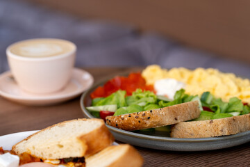 Healthy Breakfast Plate with Coffee and Fresh Bread on Wooden Table