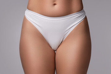 Close-Up of Woman Wearing White Cotton Panties for Skincare and Beauty Concepts