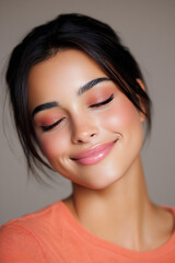 smiling model with coral blush and natural eyebrows soft beauty portrait