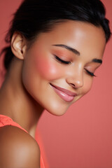 smiling model with coral blush and natural eyebrows soft beauty portrait