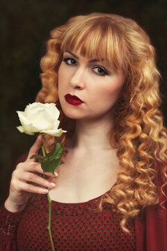 Portrait Of Woman Holding Rose