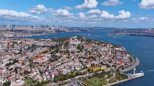 4K drone panorama of Istanbul&rsquo;s Sultanahmet - Hagia Sophia, Blue Mosque and Topkapi Palace - beside the Bosphorus and Sea of Marmara, ships and bright clouds. Iconic Turkey skyline establishing shot.