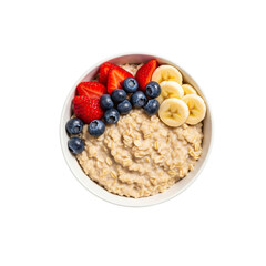 Healthy oatmeal bowl with fresh berries and banana isolated on transparent background
