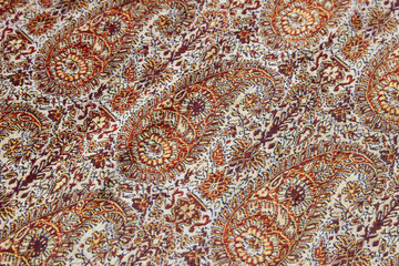 Intricate Paisley Pattern with Vibrant Ornamental Designs on Fabric Texture